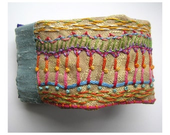 Hand Embroidered Multi-Colored Cuff with Orange Buttons