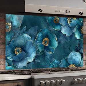 May include: A teal floral kitchen backsplash with large blue flowers and gold accents. The design features a dark teal background with detailed leaves and petals. The backsplash is installed behind a stainless steel range.