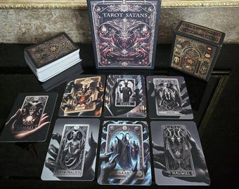 May include: Tarot Satans deck with black and gold box, featuring dark imagery and illustrations of demons and angels. The cards include names like Samael, Andromalius, and Haumiel.