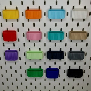 AirPods holder for IKEA SKADIS with charging hole in the bottom suitable for all AirPods in different colors with outer ribs, 3D printed