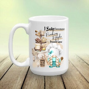 May include: White ceramic mug with a humorous baking-themed design. It features the text "I Bake because Punching People is frowned upon" and a gnome chef. The mug also includes the phrase "Baking is my therapy."