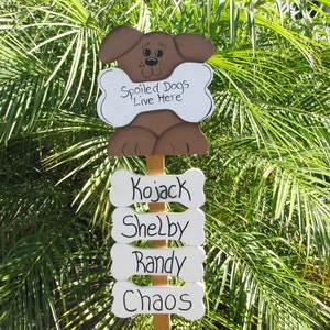 Personalized spoiled dogs live here garden stake