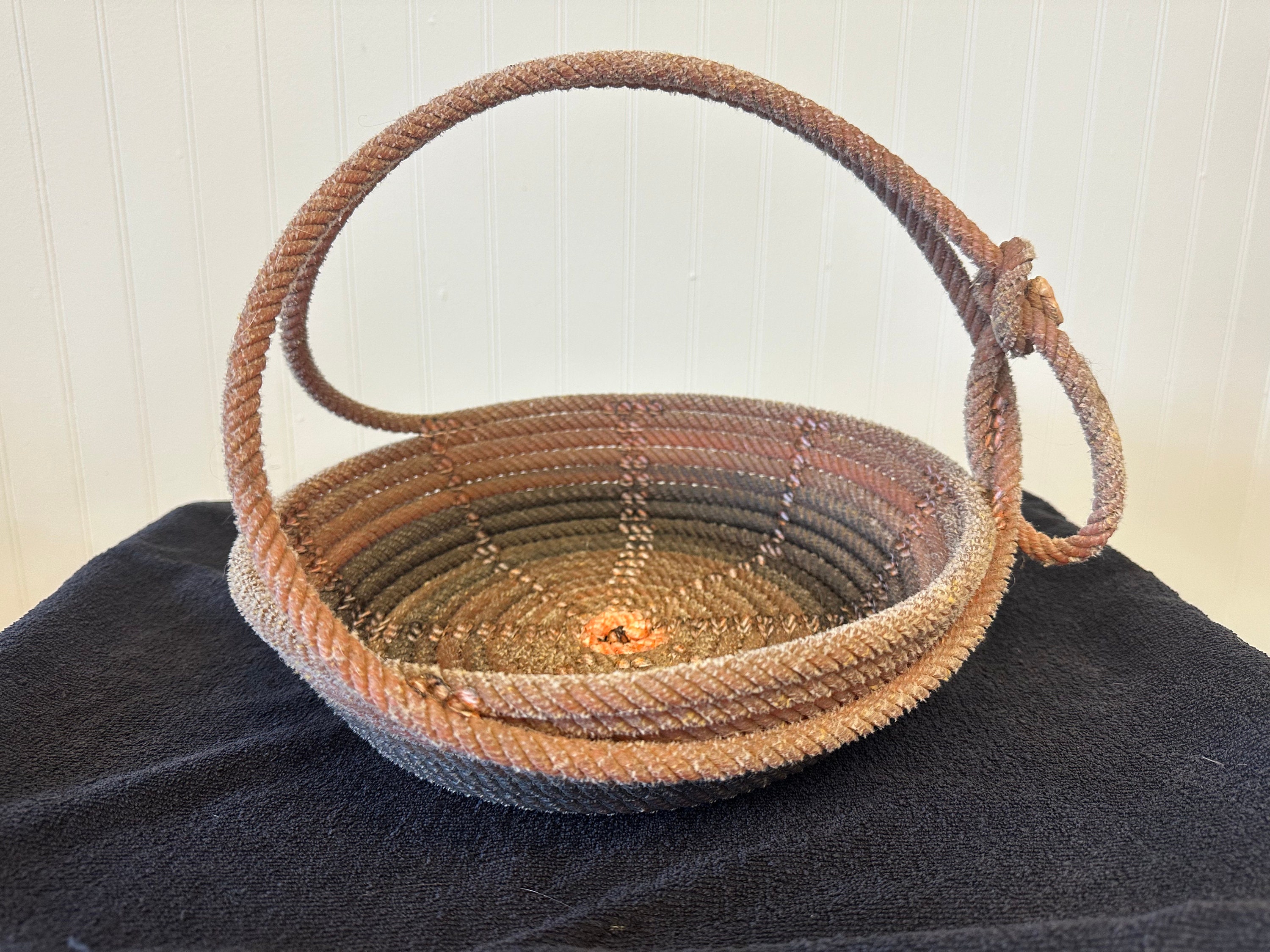 A27burnt orange lariat rope basket, lasso basket, rope basket