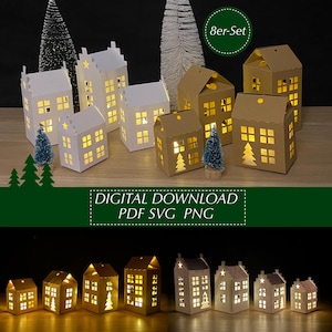 Könnte beinhalten: Eine Sammlung beleuchteter Papierhausdekorationen in verschiedenen Größen und Farben, darunter Weiß und Braun. Die Häuser haben ausgeschnittene Fenster, einige zeigen ein Baumdesign. Der Text "8er-Set" und "DIGITAL DOWNLOAD PDF SVG PNG" sind sichtbar.