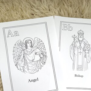 May include: Two black and white illustrations on white paper. One shows an angel holding a scroll, labeled "Angel". The other depicts a bishop with a cross, labeled "Bishop". The illustrations are part of an alphabet series.