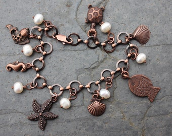 Ocean Bounty Charm Bracelet - Antiqued copper, pearls, fish, shells, turtle - beach - rustic cottage chic - free shipping in USA