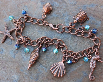 Ocean Beach Charm Bracelet - Antiqued copper turtle, seahorse, shells, starfish - capri blue & turquoise crystals-