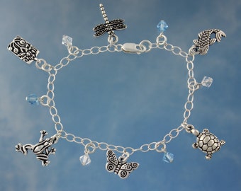 Zen Pond Silver Charm Bracelet - turtle, frog, lotus, koi, dragonfly & butterfly charms with aquamarine blue and clear crystals