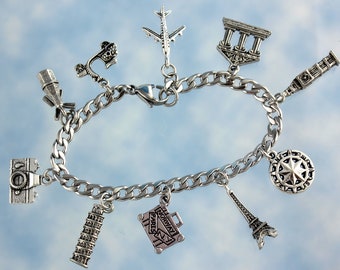 European Vacation Stainless Steel & Silver Pewter Charm Bracelet -travel themed charms - airplane, compass, suitcase, camera, monuments