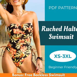 Peut inclure: Maillot de bain bustier froncé noir avec un motif floral orange et jaune. Le maillot de bain a des liens latéraux réglables et est présenté sur une personne sur une plage. Le texte sur l'image indique "Ruched Halter Swimsuit" et "XS-3XL".