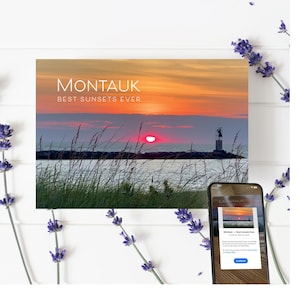 May include: A postcard with a photo of a sunset over the ocean with a lighthouse in the distance. The text "Montauk - Best Sunsets Ever" is printed on the postcard.
