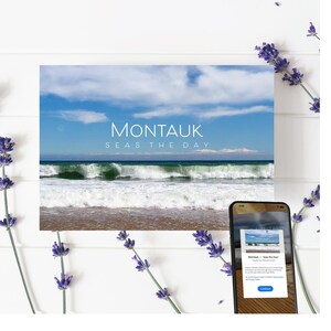 May include: A postcard with a photo of a beach with waves crashing on the shore. The sky is blue with white clouds. The text "Montauk Seas the Day" is printed on the postcard.