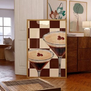 May include: Two brown and white coffee cocktails with coffee beans on top, set against a brown and white checkered background.