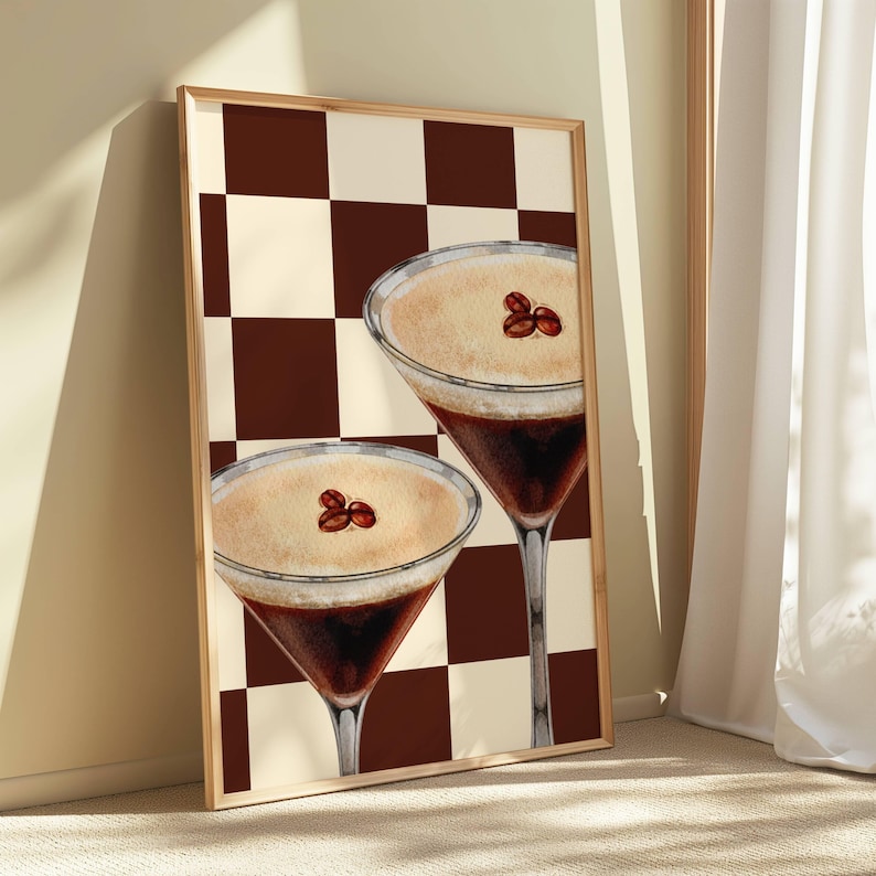 May include: Two brown and white coffee cocktails with coffee beans on top, set against a brown and white checkered background.