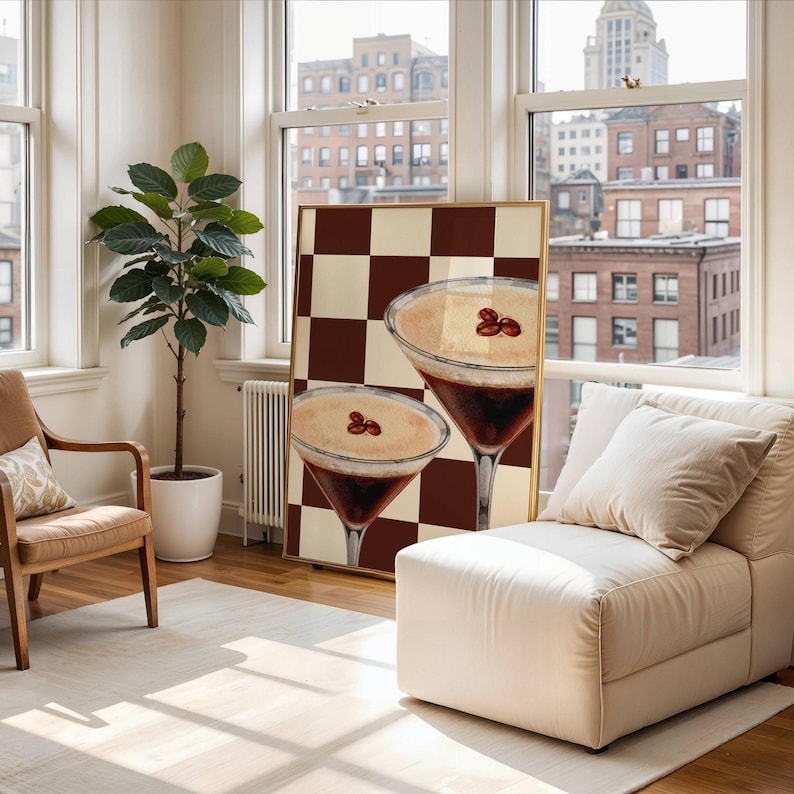 May include: A framed print of two espresso martinis on a brown and white checkered background.