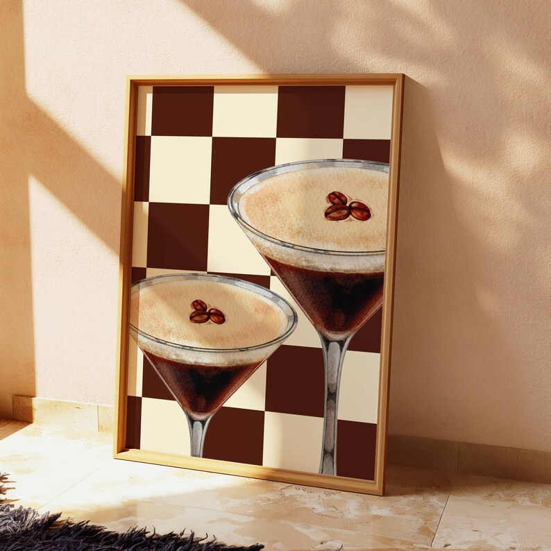 May include: Two espresso martinis with coffee beans on top, set against a brown and white checkered background.