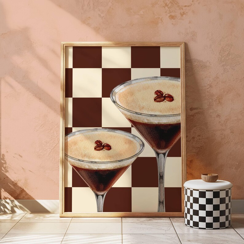 May include: Two brown and white coffee cocktails with a brown and white checkered background. The cocktails have a creamy white top with coffee beans on top.