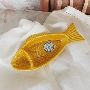 Ceramic fish shape olive serving bowl in yellow color