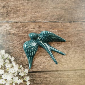 Medium ceramic petroleum blue swallow for wall decor (9.5x 8.5cm)