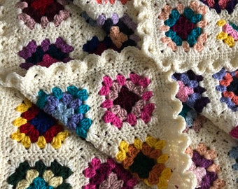 Crochet Granny Square blanket with crochet eyelet border