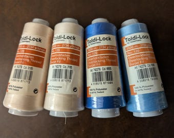 Toldi-Lock by Guttermann Lot of 4.  2 spools of Beige. 1 each light blue and blue  100% Polyester  2734 yds in each spool  Destash