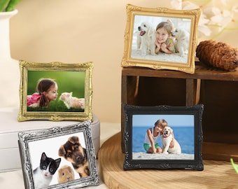 May include: Four decorative picture frames with ornate gold, silver, and black frames. Each frame features a different photograph of children and pets.