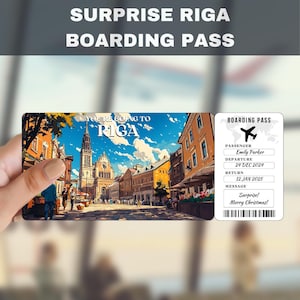 May include: A boarding pass with a photo of a street in Riga, Latvia. The text on the boarding pass reads "You're going to Riga" and "Surprise! Merry Christmas!"