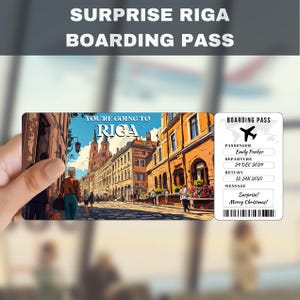 May include: A boarding pass with a picture of a street in Riga, Latvia. The text on the boarding pass says "You're going to Riga" and "Surprise! Merry Christmas!"