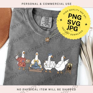 May include: Gray Comfort Colors t-shirt featuring a whimsical illustration of four geese engaged in artistic pursuits. One goose paints, another works on pottery, a third sketches, and the last displays a painting. The shirt includes the text "PERSONAL & COMMERCIAL USE".