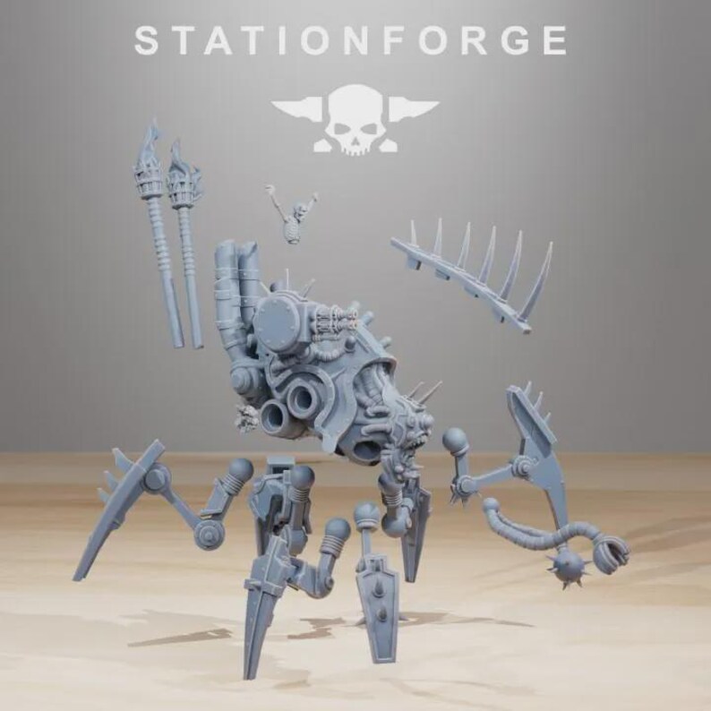 May include: A disassembled, light gray model kit with the text "STATIONFORGE" above. The kit includes various mechanical components, including a central body, legs, and additional parts like torches and spiked elements. A skull and crossbones logo is also visible.