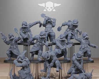 Op de afbeelding: Een verzameling grijze miniatuurfiguren van soldaten in gevechtshoudingen. Elke figuur draagt een helm en gasmasker, sommigen houden schoppen of geweren vast. De tekst "STATIONFORGE" staat bovenaan.