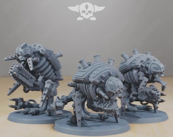 May include: Three gray, detailed miniature war machines with mechanical and skeletal features. The models are on round bases, with the text "STATIONFORGE" and a skull logo above them. The machines have various weapon attachments.