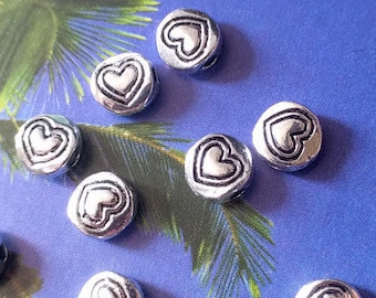 20 round beads with etched heart detail, silver tone, 6mm