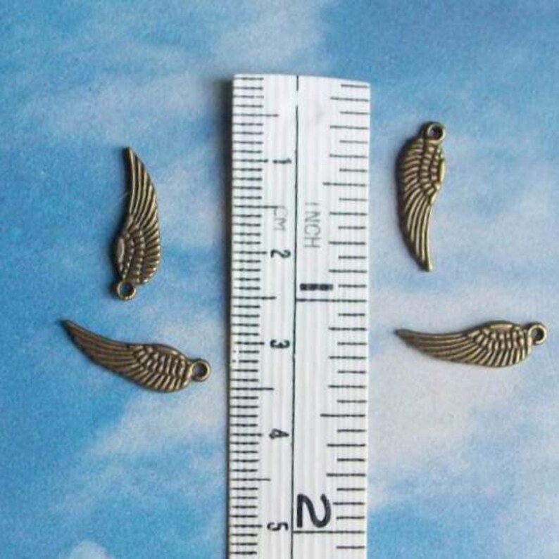 20 tiny wing charms, bronze tone, 17mm image 2