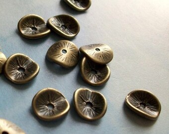 20 curved petals with etched detail, spacers or bead caps, antique bronze tone, 10mm