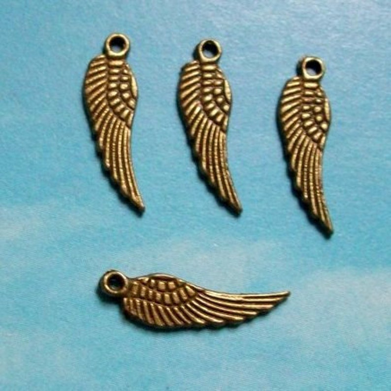 20 tiny wing charms, bronze tone, 17mm image 1
