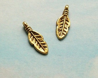 20 tiny rounded feather or leaf charms, gold tone, 17mm