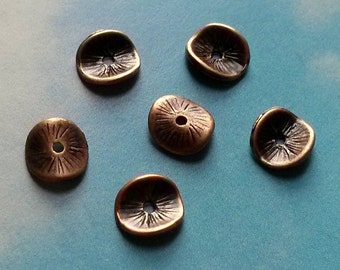 20 curved petals with etched detail, spacers or bead caps, dark copper tone, 10mm