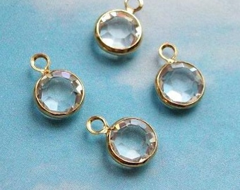 10 tiny white (clear) swarovski crystal charms, gold plated setting, 7mm