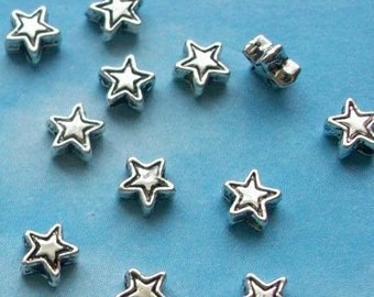 100 very tiny star beads, etched outline, silver tone, 4mm