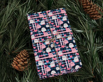 Papel de regalo de Halloween: fantasmas sonrientes, corazones y lazos