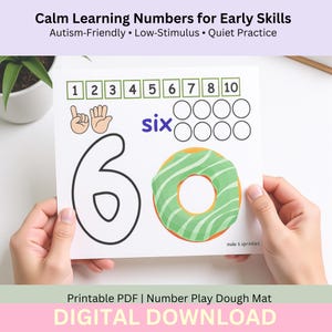 May include: A white number play dough mat with the text "Calm Learning Numbers for Early Skills". The mat features numbers 1-10, a hand gesture, the word "six", a donut with green frosting, and the text "mole 6 sprinkles".