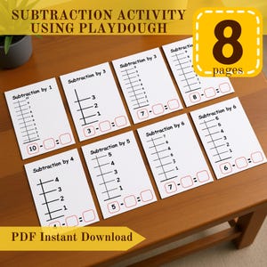 Op de afbeelding: Een set van acht witte aftrekactiviteitpagina's met zwarte lijnen en rode vakken, ontworpen voor gebruik met klei. De pagina's zijn gerangschikt op een houten oppervlak, met de tekst "SUBTRACTION ACTIVITY USING PLAYDOUGH" bovenaan.