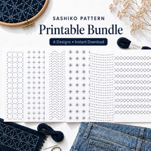 May include: A Sashiko pattern printable bundle featuring six distinct geometric embroidery designs on white paper. The set includes a wooden embroidery hoop with dark blue fabric, a skein of dark blue thread, and a pair of blue denim jeans.