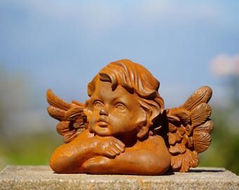 Cast Iron Dreaming Angel Sculpture: Rustic Garden Decor