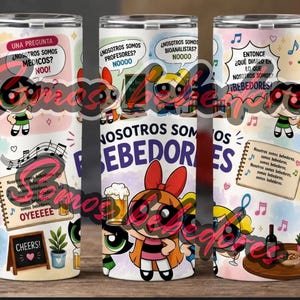 May include: Three stainless steel tumblers with cartoon characters and Spanish text. The tumblers feature colourful designs with phrases like "Nosotros Somos Bebedores" and "Cheers!" with musical notes and food illustrations.