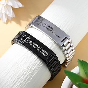 May include: Two medical alert bracelets with link-style bands. One is silver-toned with the text Diabetic Allergy-Haloperidol and a Star of Life symbol. The other is black with the text Addison's Disease Steroid Dependent and a Star of Life symbol.