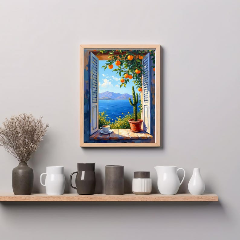 May include: A framed painting depicts an open window overlooking a vibrant blue sea and mountains. An orange tree with ripe fruit hangs over the window. A cactus in a terracotta pot sits on the windowsill. A cup of coffee rests on a saucer.