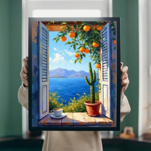 May include: A framed art print depicts a scenic view through a window. The artwork showcases a vibrant blue sea, mountains, and a bright sky. Orange tree branches with ripe fruit hang over the window. A cactus in a terracotta pot and a cup of coffee are on the windowsill.