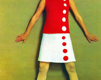 May include: A red sleeveless top with white circles and a white skirt with red circles. The model is wearing red shoes.